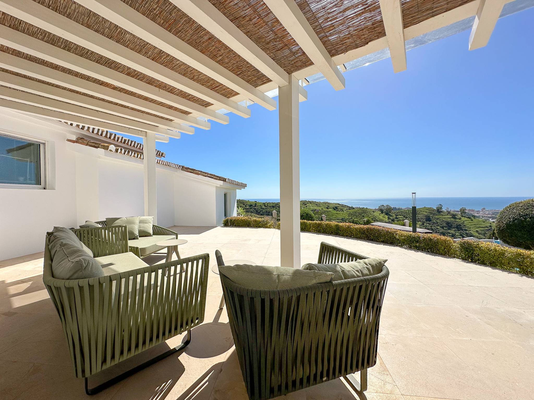 Spacious terrace and lounge area with sea views